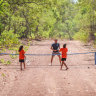 *** SINGLE USE FOR PRINT AND ONLINE ONLY ***
Tennis coach Anzac Leidig teaching indigenous kids in the Northern Territory. Credit: Tennis Australia