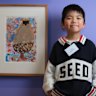 Logan Zhang, 6,  with his winning portrait, ‘My Dad’.