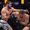 Islam Makhachev trades punches with Jack Della Maddalena in the UFC welterweight championship fight at Madison Square Garden on Saturday, local time.