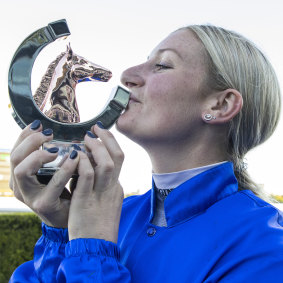 Jamie Kah poses with the trophy after winning The Doncaster Mile on Cascadian at Royal Randwick.