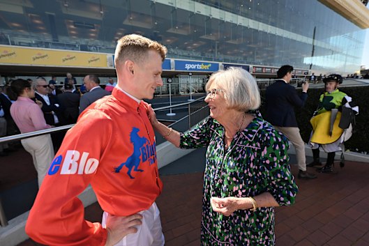 Jockey Ethan Brown with his grade one primary school teacher Marg Simonetto during Caulfield Cup week.