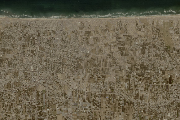 Tent camps line the beach and fill empty lots outside the central Gaza city of Deir al-Balah on Friday.