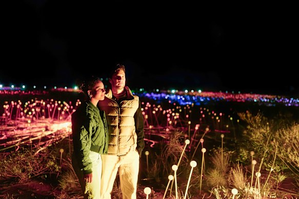 Field of Light brings Uluṟu to life after dark, with 50,000 glowing spheres illuminating the desert in a gently shifting sea of colour.