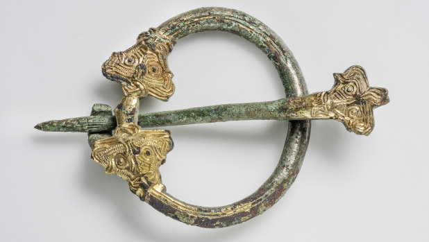 A bronze and gilded brooch.