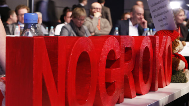 Letters reading 'nogroko' (no great coalition) stand on a table during a party meeting of the Social Democrats, SPD, where they are discussing the possible coalition talks with Chancellor Angela Merkel's conservatives in Bonn on Sunday.