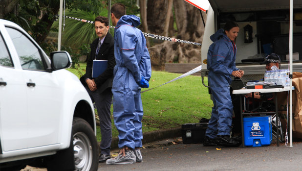 Police collect evidence at a home in The Gap.