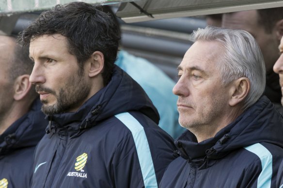 Watching on: A disappointing debut for van Marwijk (right) in his first appearance as Socceroos manager.
