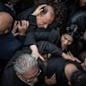 Family members grieve during the funeral service for Pierre Mouawad and his wife, who were killed in a drone strike at their home, in the Christian village of Yahshush on April 07, 2026 in Beirut, Lebanon. Israel has continued its aerial and ground assault in Lebanon after Hezbollah, the Iran-backed militant group in Lebanon, launched missiles at Israel in what it said was retaliation for the joint U.S.-Israeli war on Iran.