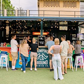 A Stomping Ground beer shipping container is on site.