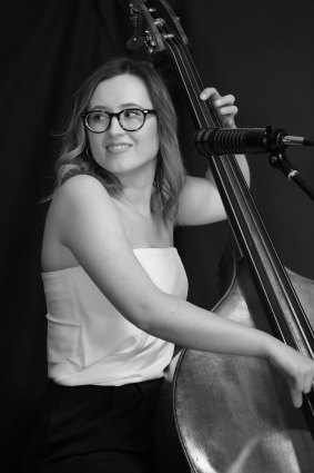 Lauren White performs the still-rare trick of singing while playing double bass.