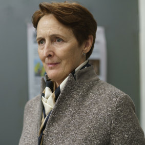 Fiona Shaw is stitched up in tweed as MI6's Carolyn Martens in series one.