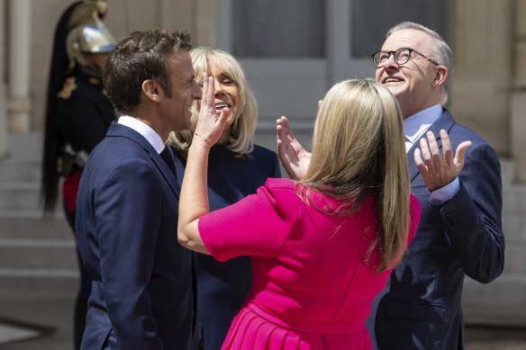 Prime Minister Anthony Albanese and his partner Jodie Haydon enjoy the sunshine with French President Emmanuel Macron and his wife Brigitte outside the Élysée Palace in Paris.