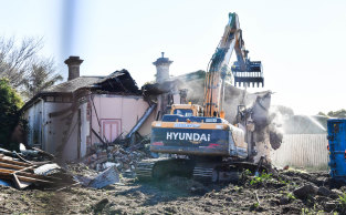 A bulldozer moves in on 368 Auburn Road, Hawthorn, on Friday.