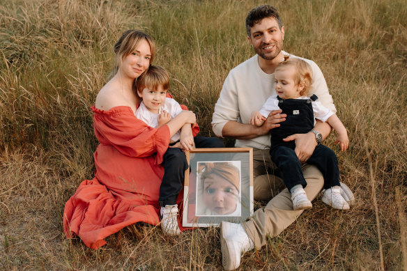 Rachael and Jonny Casella with their sons Izaac and Joshua, and a photograph of their daughter Mackenzie who is the namesake of Mackenzie’s Mission.