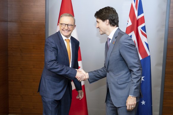 Prime Minister Anthony Albanese shakes hands with Prime Minister of Canada Justin Trudeau.