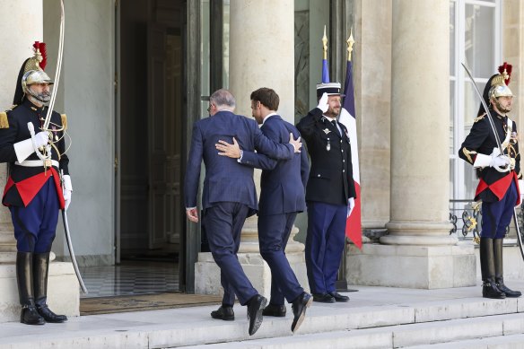 Australian Prime Minister Anthony Albanese and French President Emmanuel Macron enter Elysee Palace after delivering press statements in Paris this month.