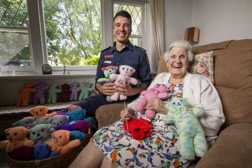 Having a yarn: Rhodesia Greatrex with teddy bears and her paramedic grandson, Luke Hesse.