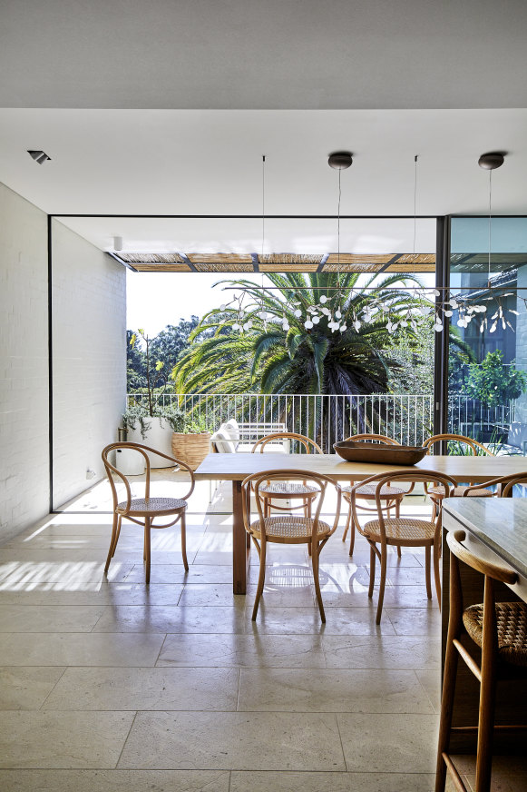 At the rear of the house, the open-plan entertaining zone flows from
the airy dining area to a spacious outdoor terrace.