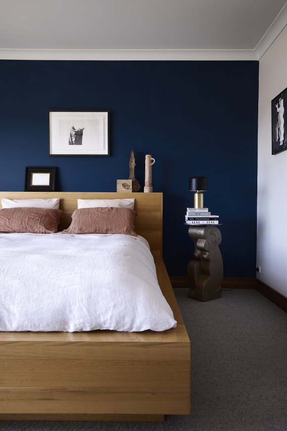 A platform bed designed by Mestrom occupies the main bedroom. Her bronze sculpture from 2021, Kneeling Before the Dawn, doubles as a bedside table. 