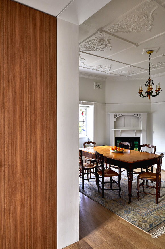 This room embraces original features such as leadlight windows, pressed metal ceilings and wooden fireplace surrounds. The hearth was hidden beneath old lino. 