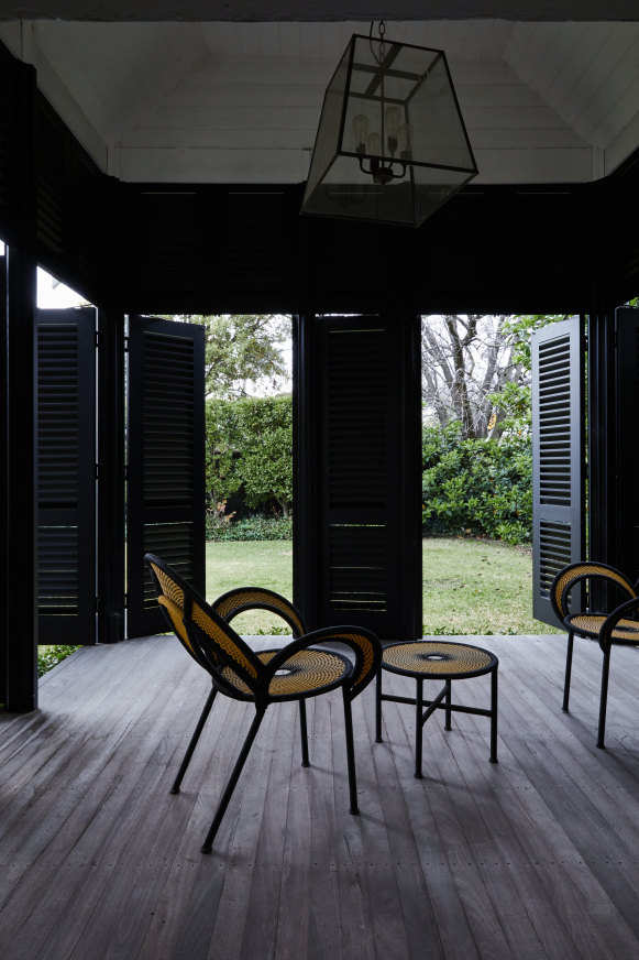 “The house has many beautiful verandahs which we restored back to their original state, then added shutters to create outdoor rooms,” says Lou. The “Banjooli” chairs are by Moroso.