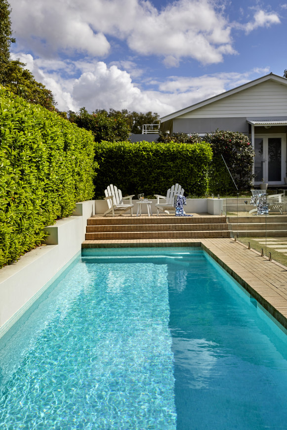 This blue-tiled heated pool with automatic in-floor cleaning looks after itself.
