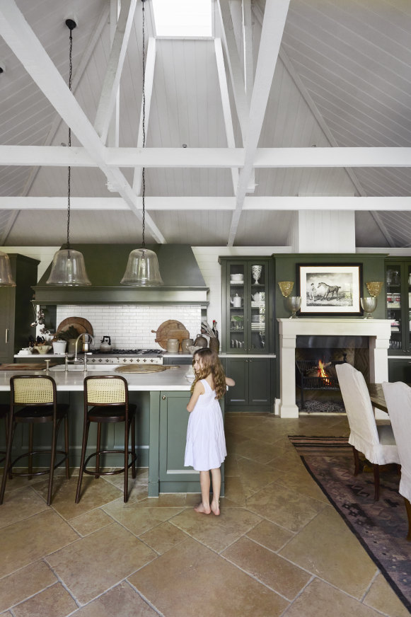 “I love the kitchen in the morning – it’s flooded by light coming up from the east,” says Charlotte. The cabinets are painted Resene Cabbage Pont.