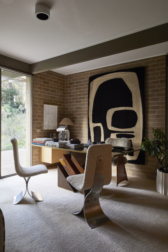 Haag sourced the desk from eModerno and chairs from the Paris flea markets; the wall hanging is from Fundamente.
