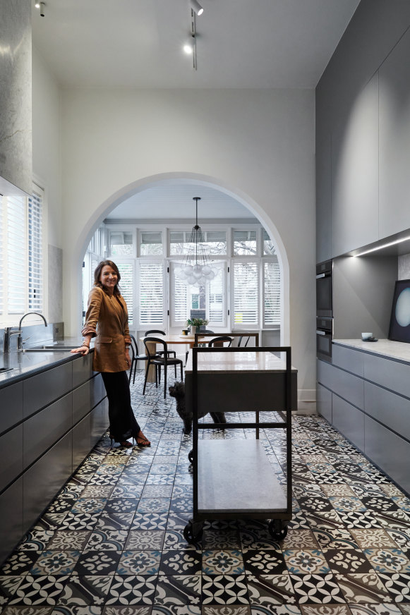 “The kitchen is always busy as I love to cook,” says Lou. “The cabinetry was designed by Templeton Architecture and the mobile island bench makes for a good servery.”