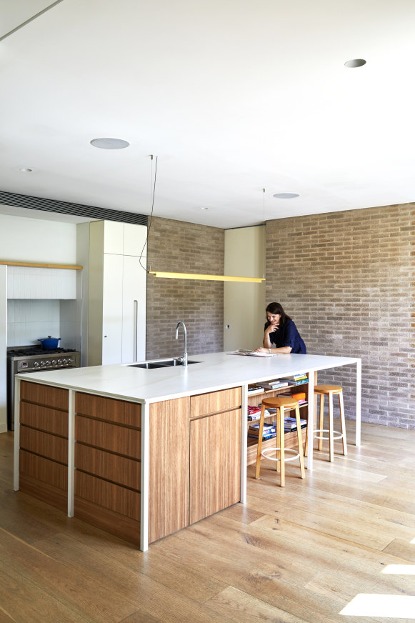 Anthea in the “heart of the home”. The island bench has a Laminam 
porcelain top and the Ilve stove sits within the kitchen’s original hearth.    