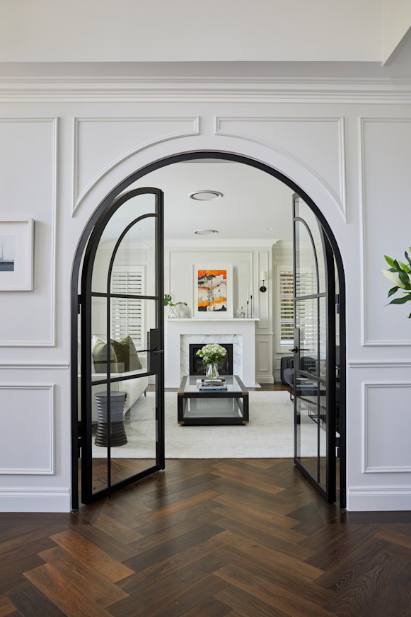 An engineered oak floor was laid in the spacious foyer which leads to the formal living room. Wainscotted panels feature throughout the home.