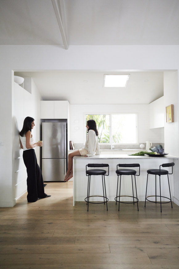 Bochnik with Gia in the light-filled kitchen. “I took out a wall to open the kitchen up,” she says. “It was a game changer.” The stools are from Grazia & Co.