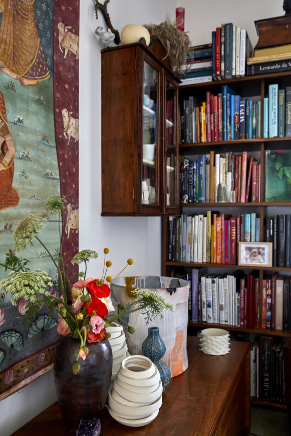 In the living space, a wooden console holds various Australian ceramic works from Szlvia György, Kate Jones and Nicole Lister, among others.   