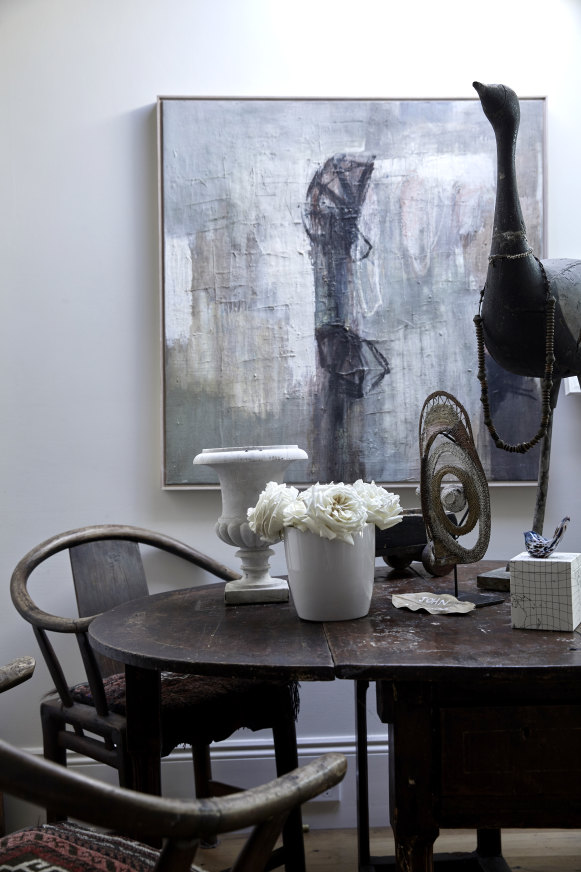 A small dining area is located opposite the kitchen. An 18th-century dropside French oak table is surrounded by late 19th-century Chinese chairs.