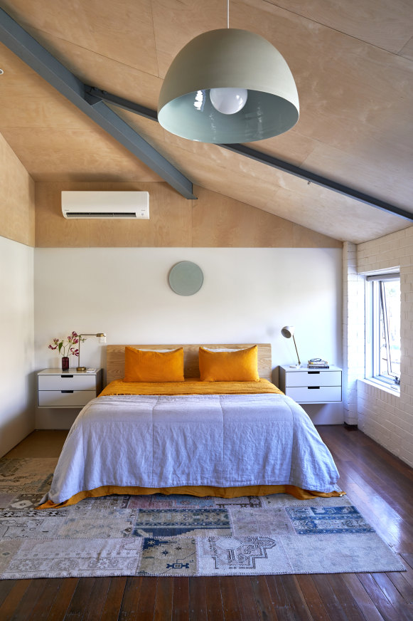 The bedroom is enclosed with plywood, with extra insulation to keep aircraft noise at bay. “It’s a simple, calm space,” says Simpson. The bedside tables are by Vitsoe