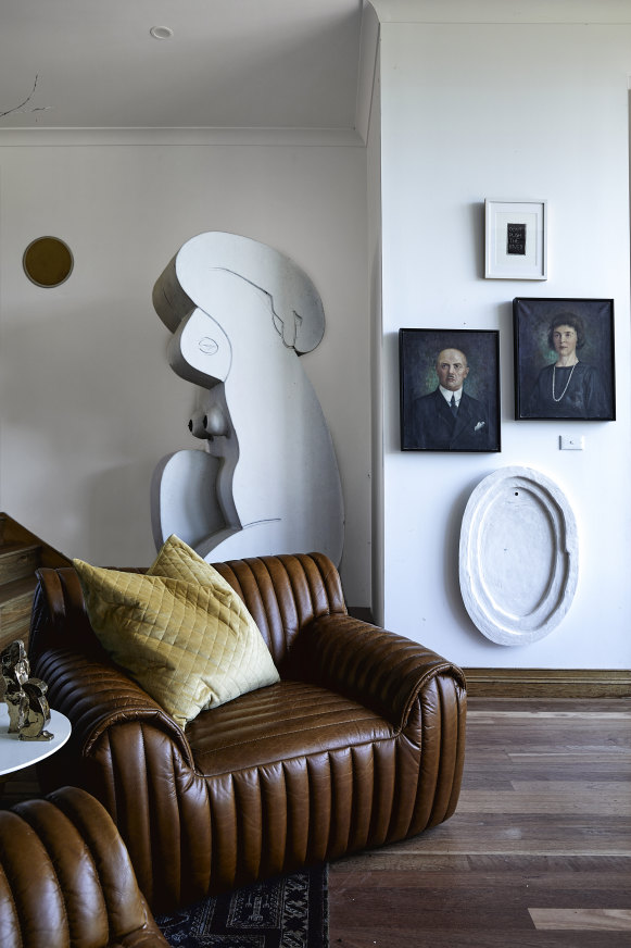 In the sitting room, two Coco Republic leather chairs create a cosy reading nook. Behind them is Mestrom’s 2019 sculpture Weeping Woman.