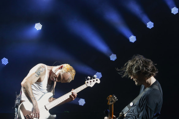 Red Hot Chili Peppers bass player Flea (left) and guitarist Josh Klinghoffer on stage at Rod Laver Arena on February 28, 2019 in Melbourne. 