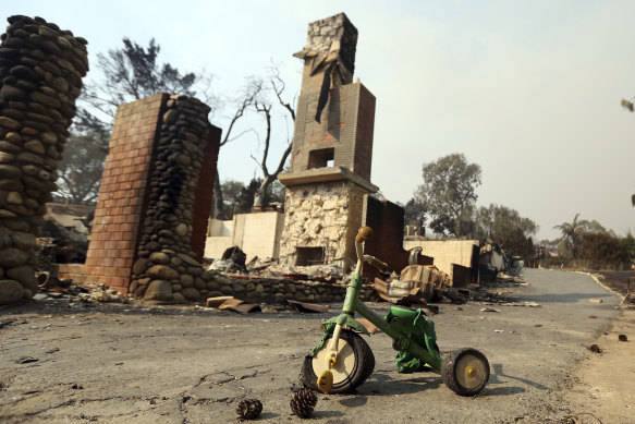 A child's toy stands outside one of at least 20 homes destroyed just on Windermere Drive in Malibu.