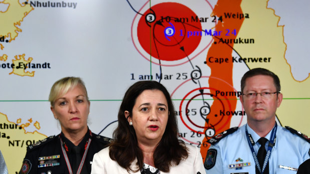 Queensland Premier Annastacia Palaszczuk (centre) at a media conference with Queensland Fire and Emergency Services Commissioner Katarina Carroll (left) and Queensland Police Deputy Commissioner Bob Gee (right) at the Emergency Management Centre in Brisbane on Saturday.