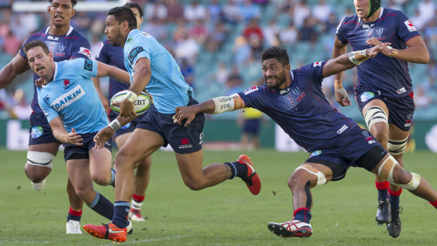 Danger man: Curtis Rona charges into the Rebels.