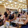 The covered courtyard is reminiscent of a 1950s Californian drive-in or a 1980s McDonald's.