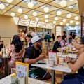 The covered courtyard is reminiscent of a 1950s Californian drive-in or a 1980s McDonald's.