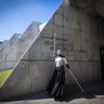 Orlando, Fla - March 01: Maggie Duckworth, of St. Louis, MO, poses as Asajj Ventress character, as the first passengers arrive for the two-day Walt Disney World Star Wars Galactic Starcruiser, which is a live action role playing game that doubles as a high-end hotel in Orlando, Fla. The event is billed as Halcyon’s 275th anniversary voyage across the galaxy. at Walt Disney World Star Wars Galactic Starcruiser in Orlando, Fla on Tuesday, March 1, 2022. First Order lieutenant Harman Croy and his garrison of stormtroopers patrol the ship. Guests arrive at Batuu, a destination for a planet excursion. Players use a data pad to play the immersive game while they participate in activities such as light saber training. (Allen J. Schaben / Los Angeles Times via Getty Images) Getty image for Traveller. Single use only.