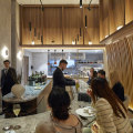 Allta’s timber slats arch over diners like a blond wood Hokusai wave.