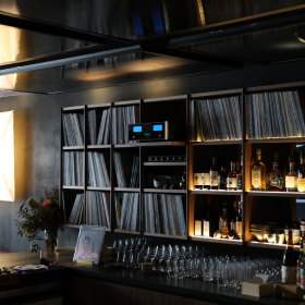 Some of the 2500 vinyl records behind the bar. 