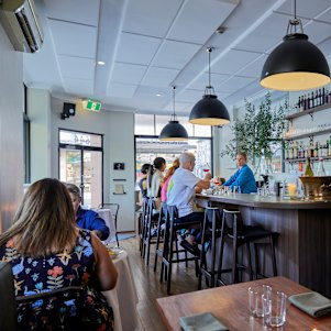 The King Street space is all forest-green and oatmeal-white with chocolate-coloured joinery.