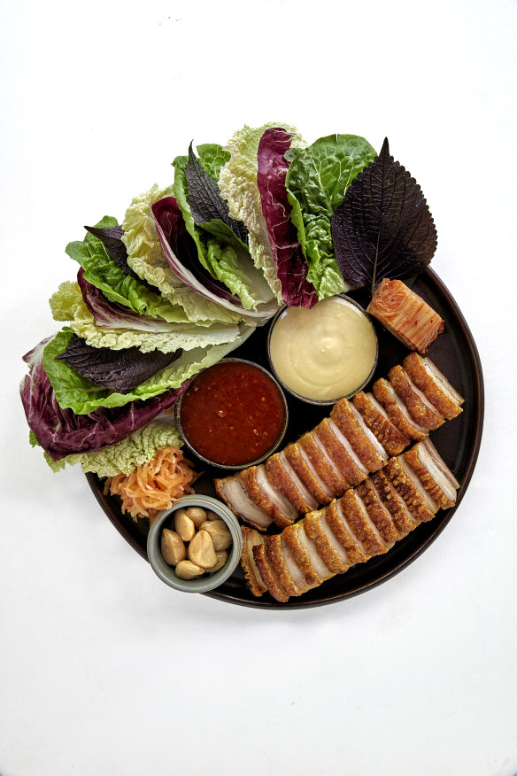 Go-to dish: Wood-roasted pork-belly ssam with leaves, pickles and condiments.