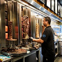 Meat is hand-carved off the spit at The Yeeros Shop.