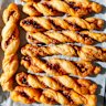 Cheese straws twisted with chilli crisp.