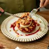 Poached peach pancake with whipped vanilla cream.